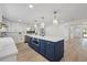 Updated kitchen featuring an island, stainless appliances, and a view into the living area at 4105 W Iowa Ave, Tampa, FL 33616