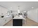 Open kitchen featuring a large island, stainless steel appliances, and modern finishes at 4105 W Iowa Ave, Tampa, FL 33616