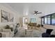 Bright living room with stylish furnishings, neutral decor, and expansive window view at 4105 W Iowa Ave, Tampa, FL 33616
