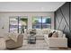 Sunlit living room showcasing a comfortable couch and an area rug at 4105 W Iowa Ave, Tampa, FL 33616