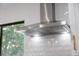 Sleek stainless steel range hood with integrated lighting and easy-to-use controls at 4105 W Iowa Ave, Tampa, FL 33616