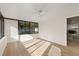 Sun-drenched room with modern windows and wood floor with view to the dining room at 4105 W Iowa Ave, Tampa, FL 33616