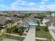Aerial view of a single Gathering home showing the lake view and proximity to neighbors at 513 Manns Harbor Dr, Apollo Beach, FL 33572