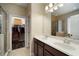 Bathroom with double vanity sinks and a walk-in closet for storage, conveniently located near the shower at 513 Manns Harbor Dr, Apollo Beach, FL 33572