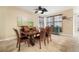 This dining room features a dark wood dining set, tile floors, and natural lighting at 513 Manns Harbor Dr, Apollo Beach, FL 33572