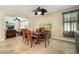 A spacious dining room with modern furniture, tile floors, and open concept layout at 513 Manns Harbor Dr, Apollo Beach, FL 33572