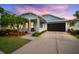 Charming single-Gathering home with a screened garage, tropical landscaping and a cozy porch at 513 Manns Harbor Dr, Apollo Beach, FL 33572