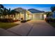 Single-Gathering home with screened garage door, landscaping, and a cozy covered porch at 513 Manns Harbor Dr, Apollo Beach, FL 33572