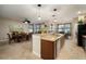Spacious kitchen with granite counters, stainless appliances, and adjacent dining area with lovely decor at 513 Manns Harbor Dr, Apollo Beach, FL 33572