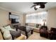 Cozy living room featuring comfortable seating, a TV, and lots of natural light at 513 Manns Harbor Dr, Apollo Beach, FL 33572