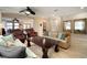 A spacious living room with tile flooring, modern furniture, and a decorative ceiling fan at 513 Manns Harbor Dr, Apollo Beach, FL 33572