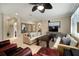 This living room features modern sofas, neutral paint and many decorative mirrors at 513 Manns Harbor Dr, Apollo Beach, FL 33572