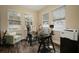 Bright office space with a glass desk, chair, and ample natural light at 513 Manns Harbor Dr, Apollo Beach, FL 33572