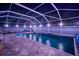 Long screened pool with lighting, a waterfall feature and covered spa with relaxing seating nearby at 513 Manns Harbor Dr, Apollo Beach, FL 33572