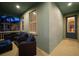 Inviting porch with comfortable wicker seating and an inviting entryway with a leaded glass door at 513 Manns Harbor Dr, Apollo Beach, FL 33572