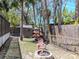 View of the backyard featuring a fire pit, seating area, and a storage shed at 5433 Palmetto Rd, New Port Richey, FL 34652