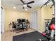 A multi-purpose room with fitness equipment, work space, and a large closet with ample storage at 5433 Palmetto Rd, New Port Richey, FL 34652