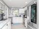 Modern kitchen with white cabinetry, stainless steel appliances, and a stylish backsplash at 5433 Palmetto Rd, New Port Richey, FL 34652