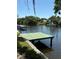 A serene waterfront view showcasing a wooden dock, perfect for fishing or enjoying the water at 5706 River Terrace, Tampa, FL 33604