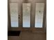 A set of three paneled doors featuring adjustable blinds and tiled flooring at the entry point of the residence at 5706 River Terrace, Tampa, FL 33604