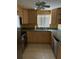 The kitchen features stainless steel appliances and sleek countertops at 5706 River Terrace, Tampa, FL 33604