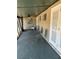 Covered screened porch offers a relaxing seating area with a ceiling fan at 5706 River Terrace, Tampa, FL 33604
