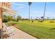 Private patio overlooks lush green golf course, palm trees and tropical landscaping at 6140 Sun Blvd # 5, St Petersburg, FL 33715