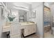 Bathroom features a vanity, large mirror, and a shower/tub combination with a curtain at 6140 Sun Blvd # 5, St Petersburg, FL 33715