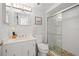 Updated bathroom boasts a new glass shower door, modern vanity and decorative tile at 6140 Sun Blvd # 5, St Petersburg, FL 33715
