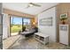 Murphy bed and sliders to patio creates flex space in bedroom with golf course views at 6140 Sun Blvd # 5, St Petersburg, FL 33715