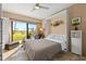 Cozy bedroom with Murphy bed, tile floors and balcony access features golf course views at 6140 Sun Blvd # 5, St Petersburg, FL 33715