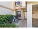 Townhouse entry featuring covered parking, a well-maintained landscape, and visitor parking at 6140 Sun Blvd # 5, St Petersburg, FL 33715