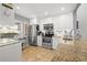 Bright kitchen with white cabinets, stainless steel appliances, and granite countertops at 6140 Sun Blvd # 5, St Petersburg, FL 33715