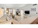 Bright living room features tile floors, fireplace, neutral colors and sliding glass door at 6140 Sun Blvd # 5, St Petersburg, FL 33715