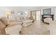 Comfortable living room with neutral-toned furniture, tile floors, and natural light at 6140 Sun Blvd # 5, St Petersburg, FL 33715