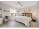 Bedroom featuring a ceiling fan, large window, and comfortable seating area at 6140 Sun Blvd # 5, St Petersburg, FL 33715