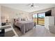 Bright main bedroom features golf course views, balcony access and a walk-in closet at 6140 Sun Blvd # 5, St Petersburg, FL 33715
