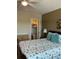 Bright bedroom with a queen-sized bed, walk-in closet, and a dresser at 6201 2Nd E St # 89, St Pete Beach, FL 33706