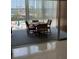 Cozy dining area with a round table and seating for four, overlooking a community pool at 6201 2Nd E St # 89, St Pete Beach, FL 33706
