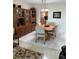 Formal dining room with cabinet storage and updated floors at 6201 2Nd E St # 89, St Pete Beach, FL 33706