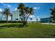 Expansive lawn area with palm trees overlooking the waterway at 6201 2Nd E St # 89, St Pete Beach, FL 33706