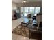 Bright living room with an open layout and views of the lanai at 6201 2Nd E St # 89, St Pete Beach, FL 33706