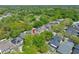 Aerial view of a home with mature trees and landscaping in a residential neighborhood at 6405 Sea Lavender Ln, Tampa, FL 33625