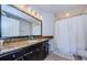 Well-lit bathroom featuring a granite vanity and a shower with white shower curtain at 700 S Harbour Island Blvd # 404, Tampa, FL 33602