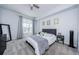 This is a comfortable bedroom with a neutral color palette, a queen bed, and a large window at 700 S Harbour Island Blvd # 404, Tampa, FL 33602