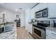 Well-lit kitchen featuring stainless steel appliances and a large sink, complemented by granite countertops at 700 S Harbour Island Blvd # 404, Tampa, FL 33602