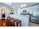 Modern kitchen area featuring stainless steel appliances, granite countertops, and wooden barstools at 700 S Harbour Island Blvd # 404, Tampa, FL 33602