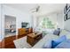 Comfortable living room featuring a view of the bedroom, a ceiling fan, and hardwood floors at 700 S Harbour Island Blvd # 404, Tampa, FL 33602