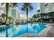 Gorgeous pool area in a residential community with palm trees and city buildings at 700 S Harbour Island Blvd # 404, Tampa, FL 33602
