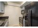 Modern kitchen features stainless appliances including fridge with water dispenser and oven at 720 Lyndhurst St # 1121, Dunedin, FL 34698